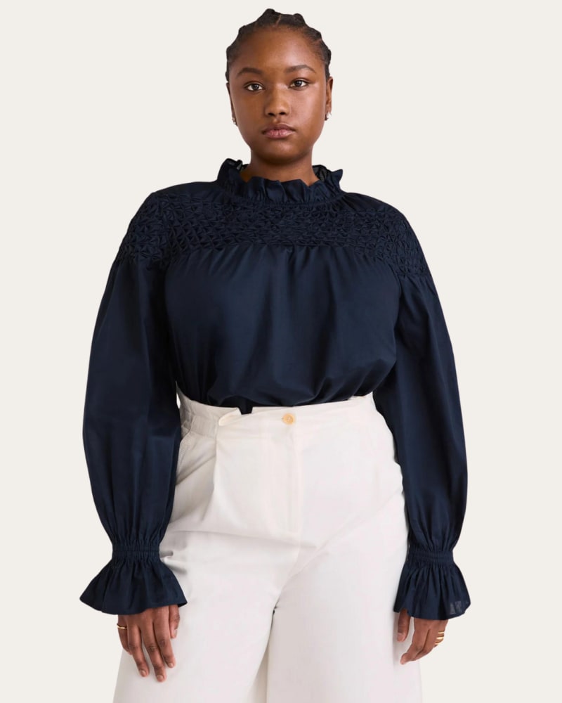 Side of a model wearing a size XL Majorelle Top in Navy by Merlette. | dia_product_style_image_id:323536